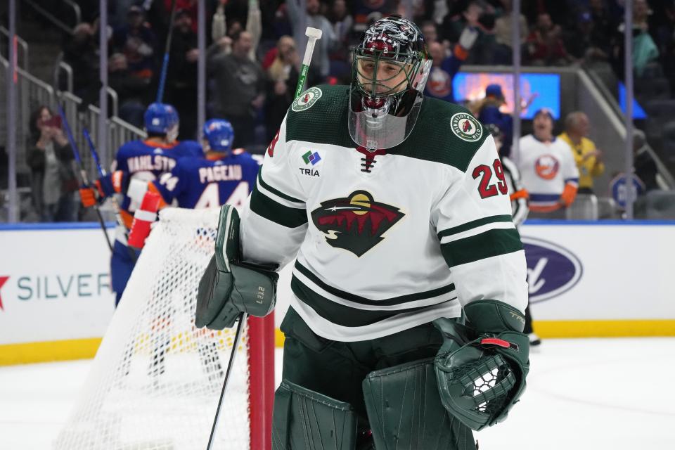 Minnesota Wild goaltender Marc-Andre Fleury (29) reacts as the New York Islanders celebrate a goal by Oliver Wahlstrom during the second period of an NHL hockey game Tuesday, Nov. 7, 2023, in Elmont, N.Y. (AP Photo/Frank Franklin II)