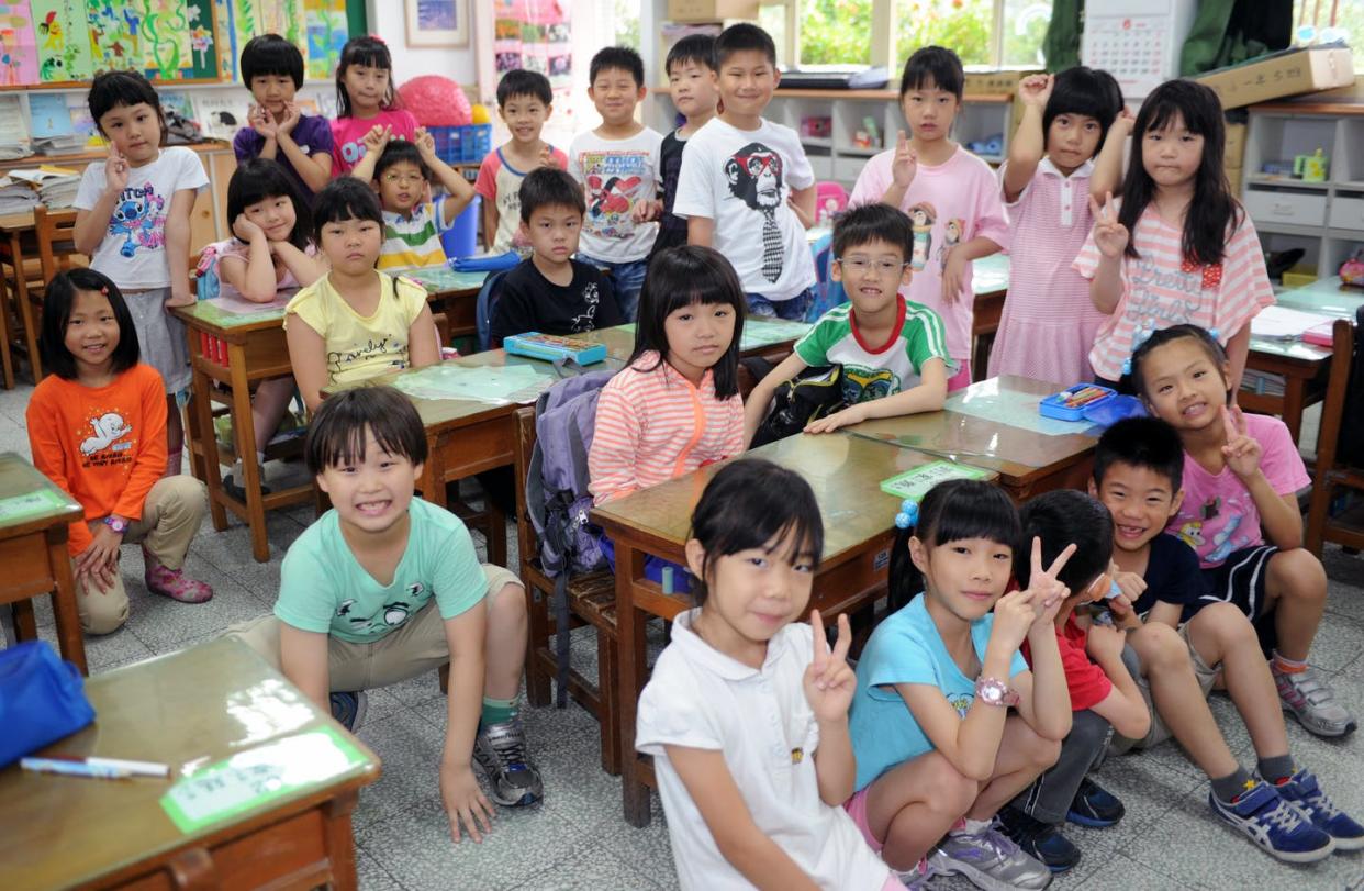 <span class="caption">Buddhist literature is used for teaching children about environmental issues in Taiwan.</span> <span class="attribution"><a class="link " href="https://www.gettyimages.com/detail/news-photo/this-picture-taken-on-on-june-5-2013-shows-7-year-old-news-photo/170723431?adppopup=true" rel="nofollow noopener" target="_blank" data-ylk="slk:Photo credit should read SAM YEH/AFP via Getty Images;elm:context_link;itc:0;sec:content-canvas">Photo credit should read SAM YEH/AFP via Getty Images</a></span>