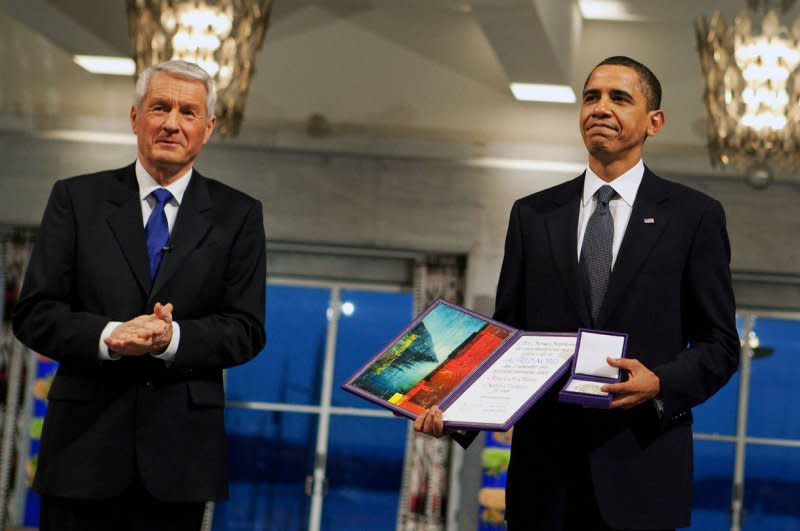 Nobel Committee Chairman Thorbjorn Jagland (L) presents U.S. President Barack Obama with the Nobel Peace Prize medal and diploma during the Nobel Peace Prize ceremony in Raadhuset Main Hall at Oslo City Hall on December 10, 2009. File Photo by Pete Souza/The White House