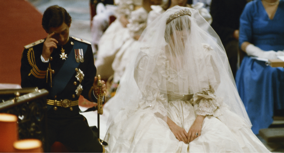 Prince Charles trying to calculate how many tonnes of tulle were used for Diana'a dress. Credit: Getty Images 