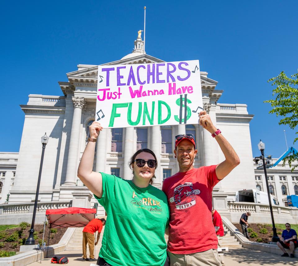 Alexandra Boudreaux and Steve Strieker, Parker High School social studies teachers in Janesville,  attend the Wisconsin Education Association Council's rally to support Governor Evers’ Education Budget on Saturday May 20, 2023 at the Wisconsin State Capitol in Madison, Wis.