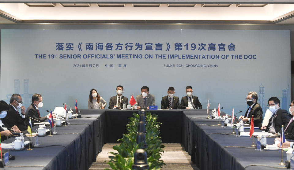 In this photo released by Xinhua News Agency, officials from China and the Association of Southeast Asian Nations (ASEAN) countries attend the 19th Senior Officials' Meeting on the Implementation of the Declaration on the Conduct of Parties in the South China Sea (DOC) in Chongqing, southwestern China, June 7, 2021. China is hosting foreign ministers from 10 Southeast Asian nations this week in the southwestern megacity of Chongqing amid heightened competition between Beijing and Washington for influence in the region. (Wang Quanchao/Xinhua via AP)