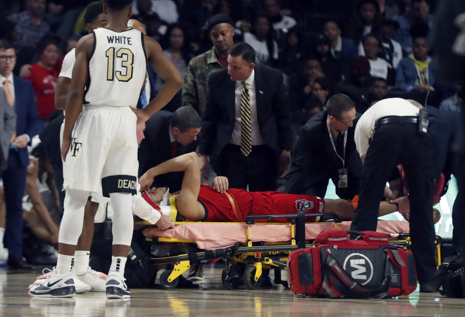 N.C. State's Jericole Hellems was stretchered off the floor after suffering a scary head and back injury late against Wake Forest on Saturday night.