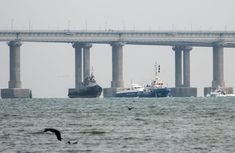 Seized Ukrainian naval ships are towed by Russia's Coast Guard vessels out of the port in Kerch