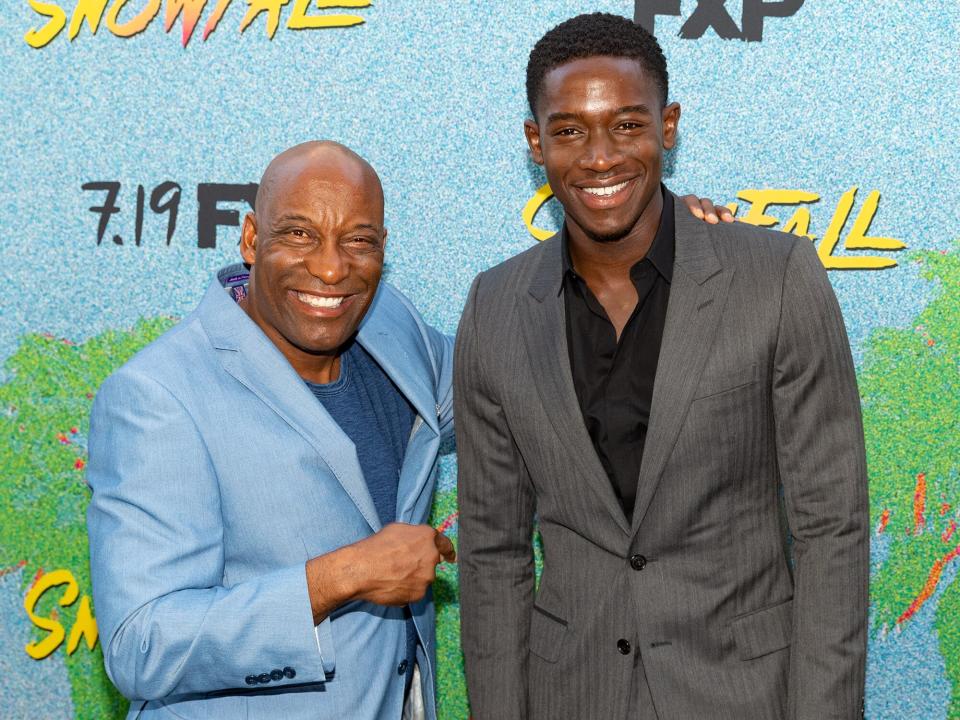 John Singleton and Damson Idris arrive to the premiere Of FX's "Snowfall" Season 2 at Regal Cinemas L.A. LIVE Stadium 14 on July 16, 2018 in Los Angeles, California