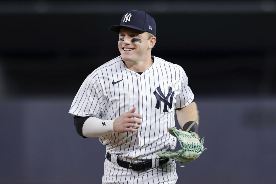 New York Yankees center fielder Harrison Bader smiles while running toward the dugout during the first inning of the team's baseball game against the Pittsburgh Pirates on Tuesday, Sept. 20, 2022, in New York. (AP Photo/Jessie Alcheh)