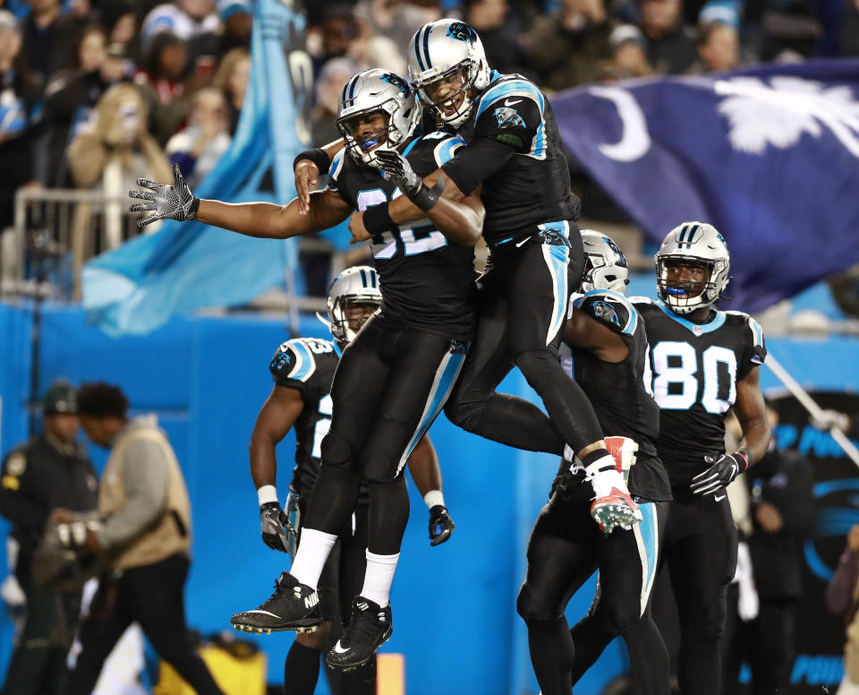 Carolina Panthers' Cam Newton, center right, celebrates with Chris Manhertz (82) after their touchdown against the New Orleans Saints in the first half of an NFL football game in Charlotte, N.C., Monday, Dec. 17, 2018. (AP Photo/Jason E. Miczek)