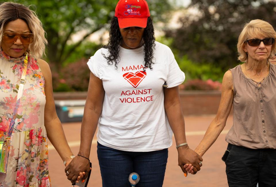 Those attending ended the event holding hands during a final prayer at the Let"s Turn It Around! community prayer on Sunday, June 12, 2022, at Jon R. Hunt Plaza in downtown South Bend. Rose Redding, center, attended representing Mamas Against Gun Violence.