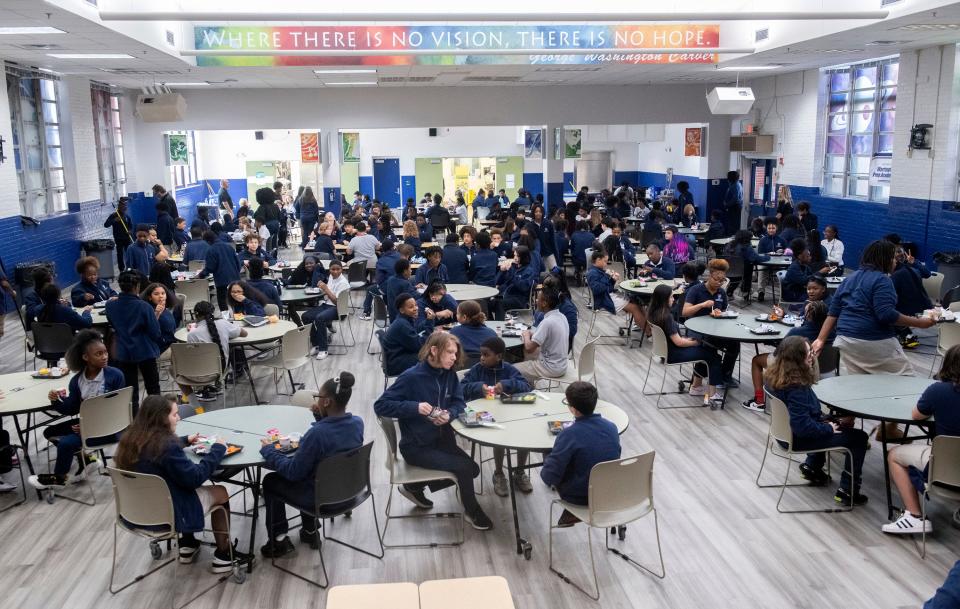 Warrington Preparatory Academy students enjoy lunch in the renovated cafeteria on Oct. 24, 2023. Charter Schools USA took over the failing middle school at the beginning of the 2023-24 school year.