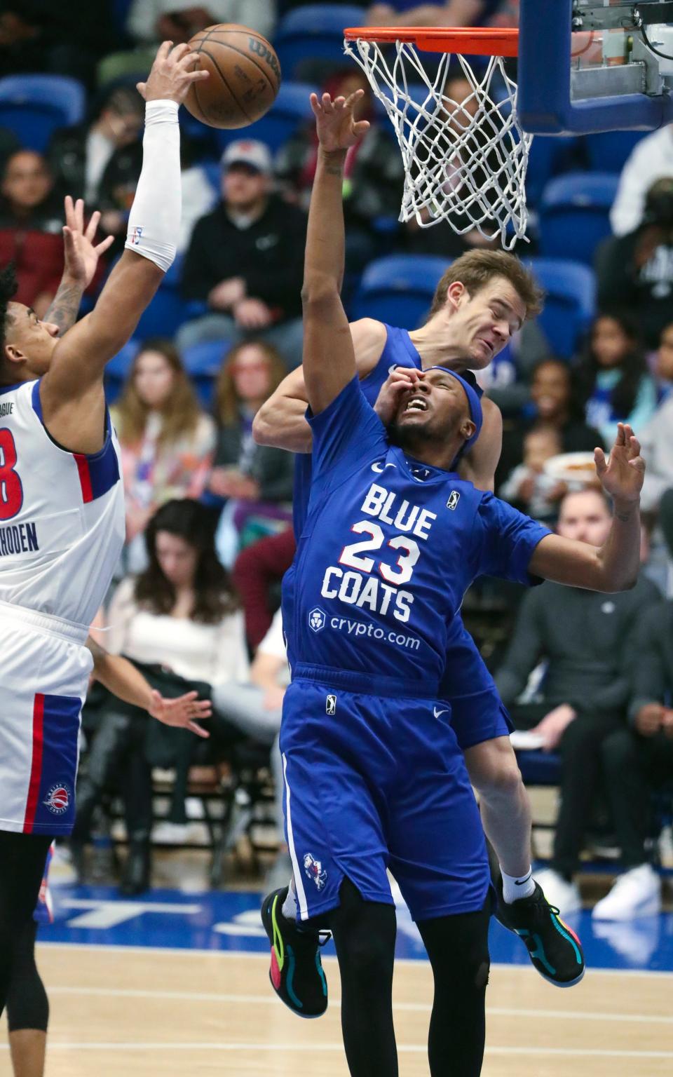 NBA slam dunk contest winner Mac McClung (top right) accidentally tangles with teammate Louis King in McClung's return to the Blue Coats in a G League game at the Chase Fieldhouse Wednesday, Feb. 22, 2023.