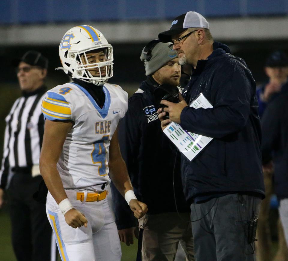 Cape Henlopen's Jameson Tingle turns to head back to his huddle with the play call from head coach Mike Frederick in the second quarter of the DIAA Class 3A state championship against Salesianum at Delaware Stadium, Friday, Dec. 1, 2023.