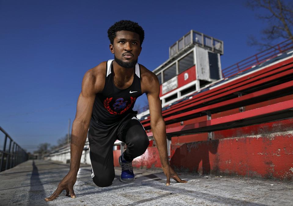 Eastmoor Academy track star Ira Graham IV poses for a photo at Eastmoor Academy High School Stadium in Columbus, Ohio on April 8, 2020.  Graham lost his spring track season due to the coronavirus.