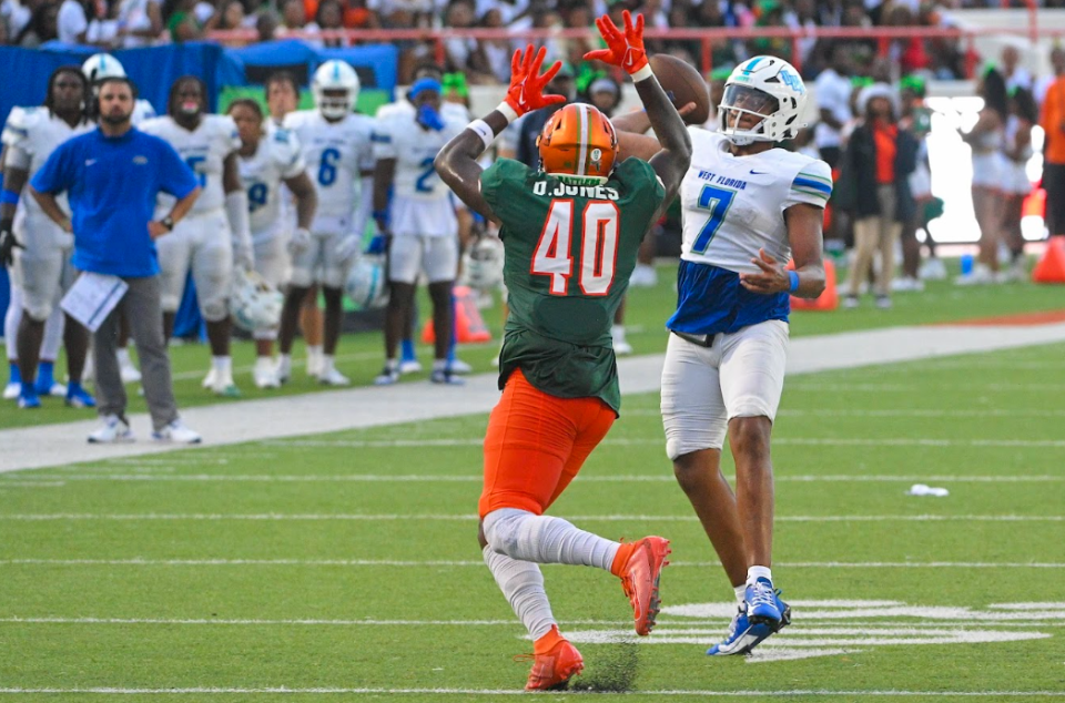 UWF quarterback Peewee Jarrett (7) attempts to throws the ball as he's pressured by Florida A&M University's Dre Jones (40) during the Argos' 31-10 loss at Ken Riley Field at Bragg Memorial Stadium on Saturday, Sept. 16, 2023.