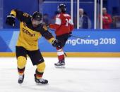 Ice Hockey - Pyeongchang 2018 Winter Olympics - Men's Playoff Match - Switzerland v Germany - Gangneung Hockey Centre, Gangneung, South Korea - February 20, 2018 - Yannic Seidenberg of Germany celebrates after scoring a goal against goalie Jonas Hiller of Switzerland. REUTERS/Brian Snyder