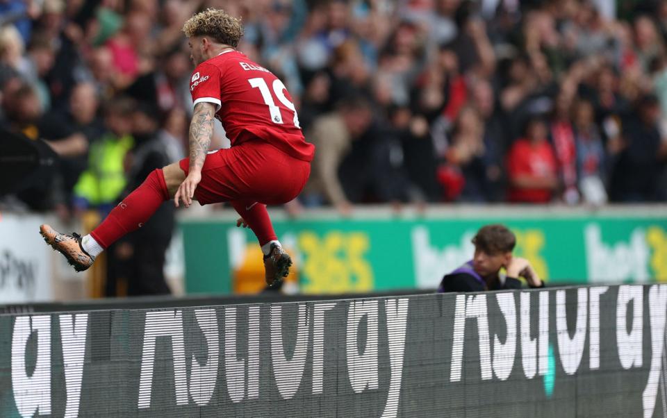 Liverpool's Harvey Elliott jumps the advertising boards