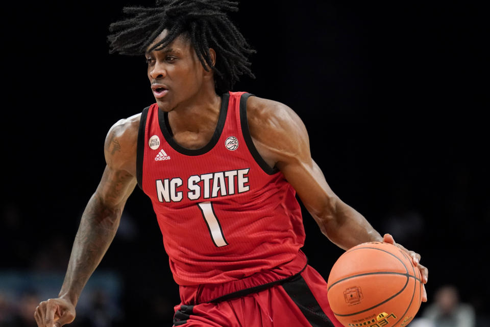 North Carolina State's Dereon Seabron (1) dribbles up the court during the first half of an NCAA college basketball game against Clemson during the Atlantic Coast Conference men's tournament, Tuesday, March 8, 2022, in New York. (AP Photo/John Minchillo)