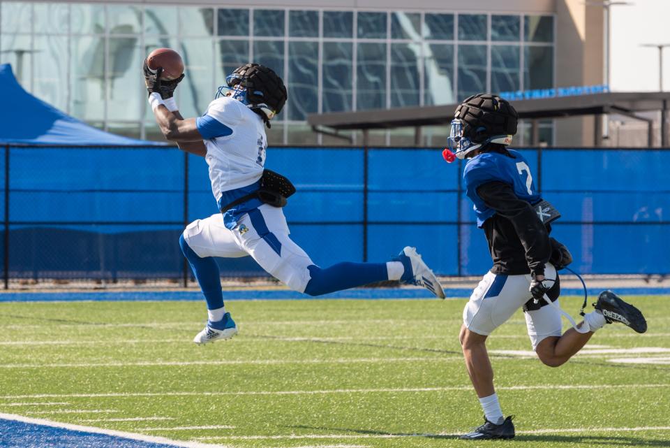 Kym Wimberly snares a pass during a Delaware football spring practice.