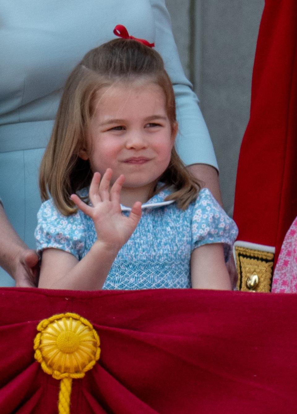 <p>Charlotte giving the royal wave.</p>