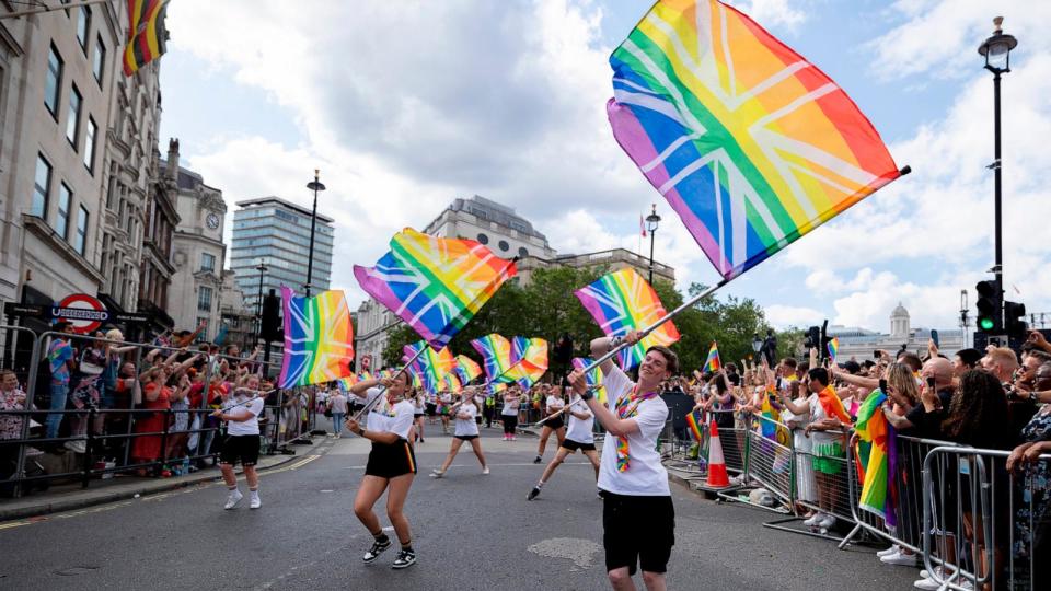 PHOTO: In this July 1, 2023, file photo, a group of performers are seen with flags at the Pride Parade in London. (LightRocket via Getty Images, FILE)