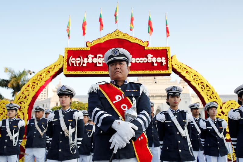 FILE PHOTO: A marching band waits to perform during Union day celebrations in Yangon