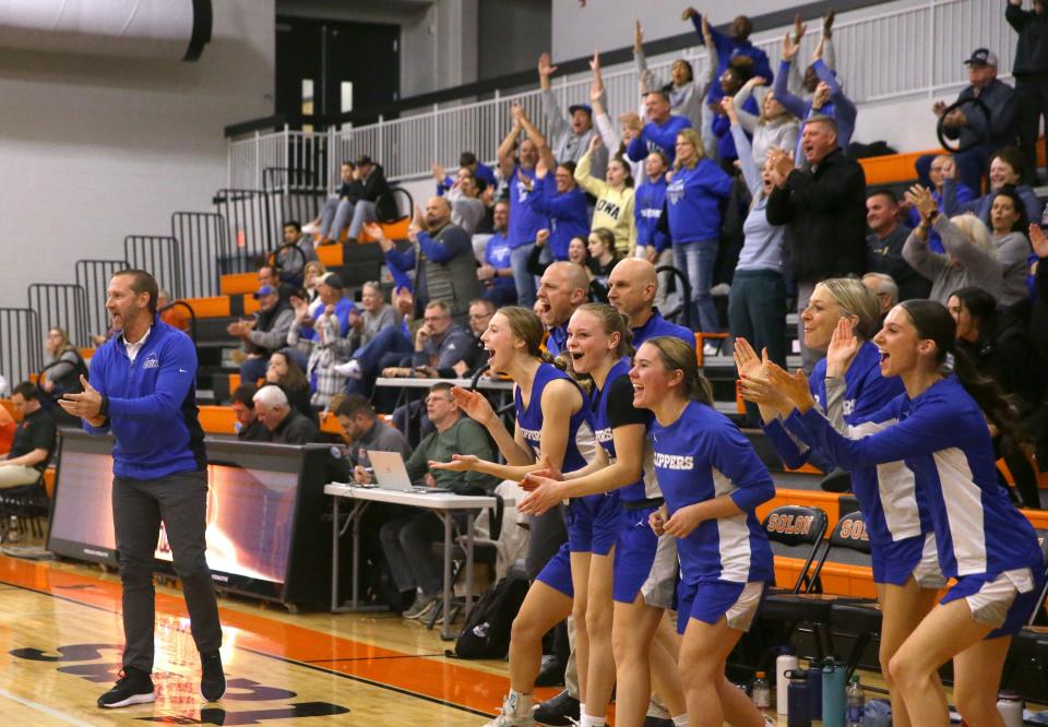 Clear Creek Amana bench and fans react during the game against Solon on Tuesday. The Clippers earned a 58-37 win over the previously undefeated Spartans.