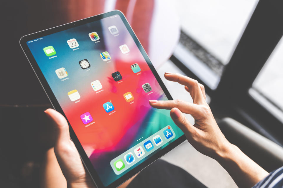 Bangkok, Thailand - Nov 22, 2018: Asian woman using the new Apple iPad pro 2018, swiping home screen or touching app icon. Illustrative editorial content