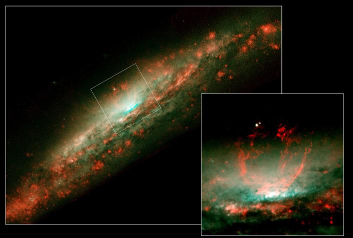 NASA Hubble Space Telescope snapshots reveal a white bubble of activity within the core of the galaxy NGC 3079. The smaller photo at right is a close-up view of the bubble. Astronomers suspect that the bubble is being blown by 