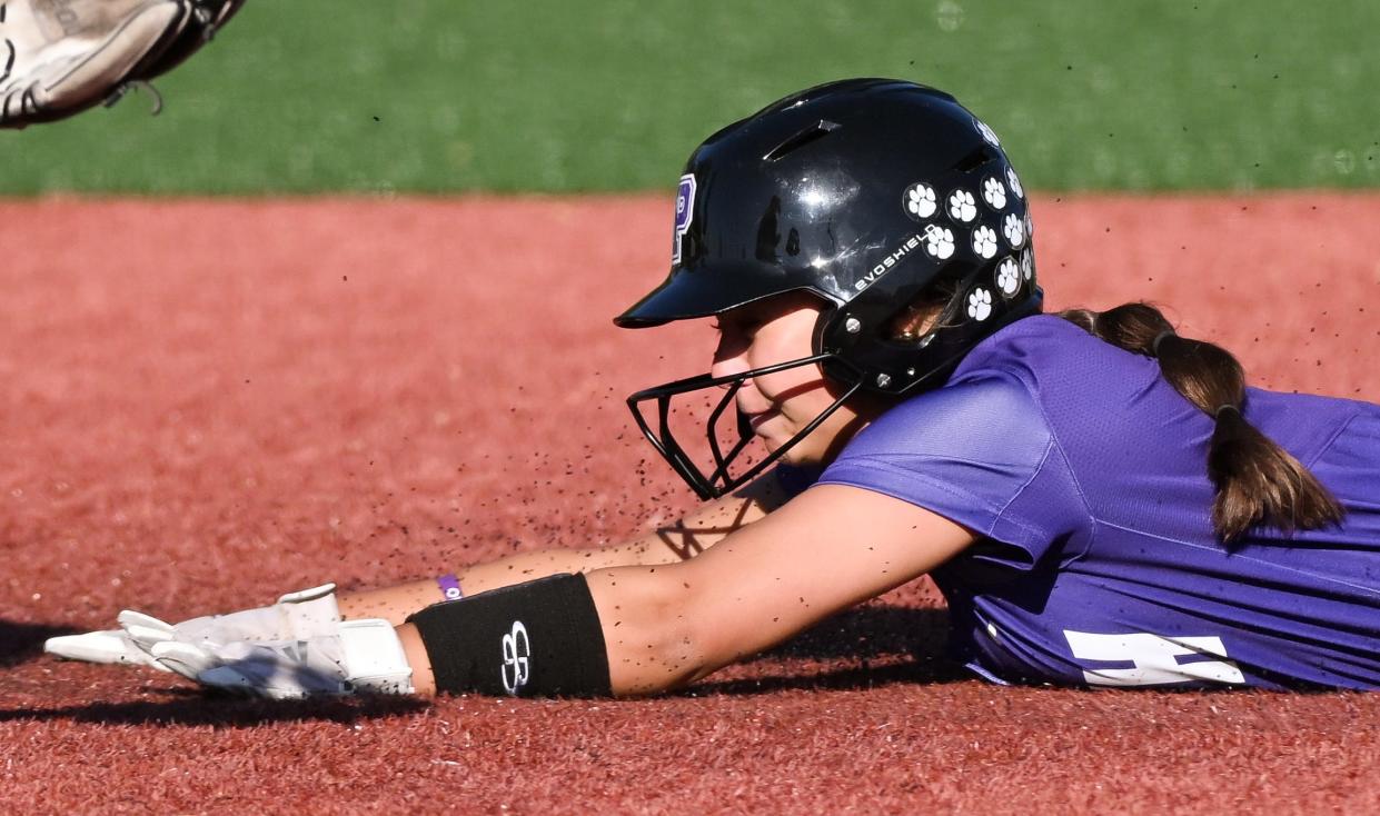 Bloomington South’s Carly Reed steals second base during the softball game against Bloomington North at South on Wednesday, April 24, 2024.