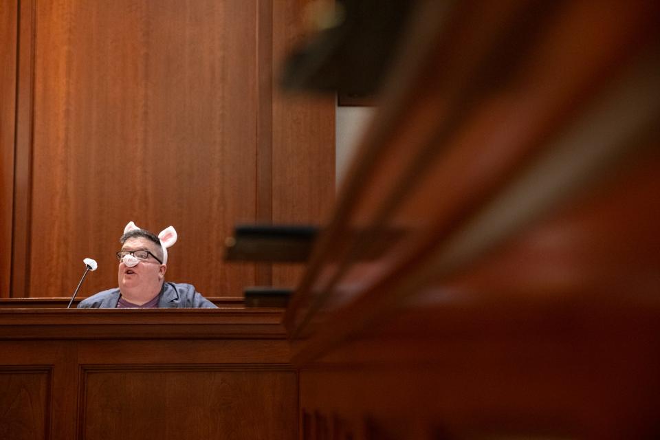 Meredith Melville, portraying the third Little Pig, testifies against The Big Bad Wolf during a mock trial at the Federal Courthouse on Thursday, Nov. 16, 2023, in Corpus Christi, Texas.