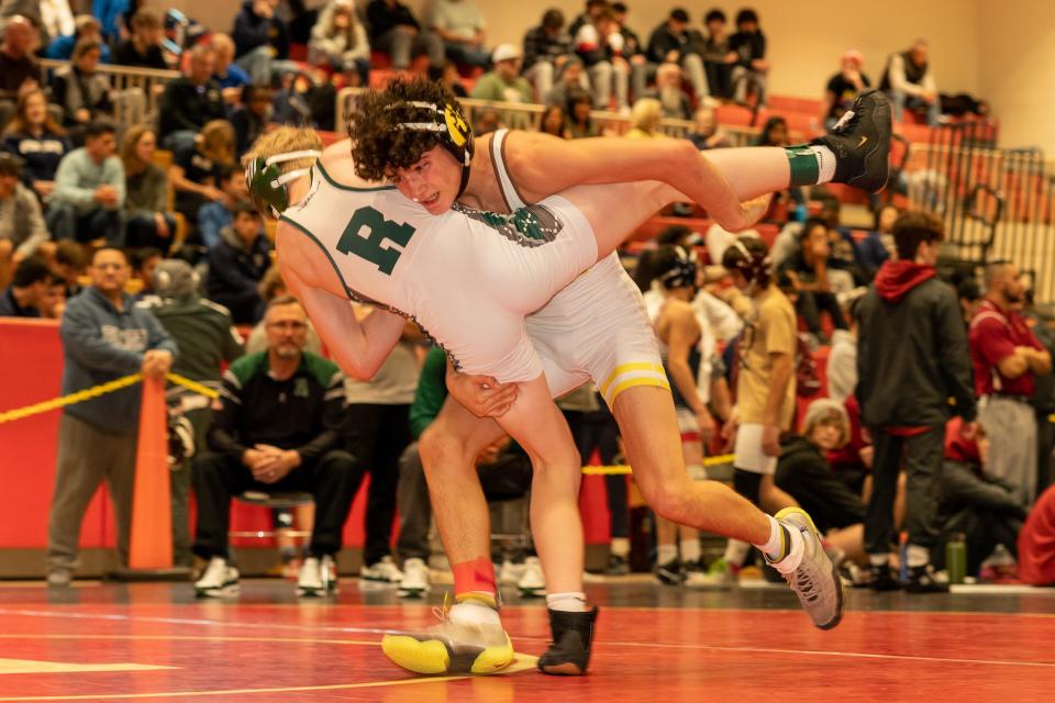 Watchung Hills Regional’s Anthony DiAndrea (red) beats Ridge’s Tanner Connelly (green) in the 106 weight class at the 2023 Somerset County Boys Wrestling Tournament on Jan. 7 at the gymnasium at Hillsborough High School in Hillsborough.