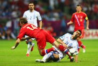 WARSAW, POLAND - JUNE 16: Kostas Katsouranis of Greece tackles Roman Pavlyuchenko of Russia during the UEFA EURO 2012 group A match between Greece and Russia at The National Stadium on June 16, 2012 in Warsaw, Poland. (Photo by Michael Steele/Getty Images)