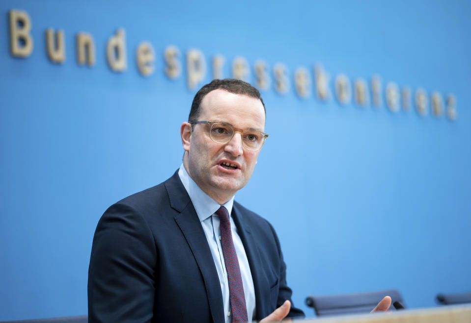 Acting German Health Minister Jens Spahn briefs the media on the current situation of the coronavirus pandemic in Berlin, Germany, Friday, Nov. 26, 2021. (Bernd von Jutrczenka/dpa via AP)