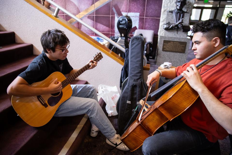 Jordan Kennedy of the band Momma’s Boys, left, and cellist Josh Witte rehearse ahead of the 26th annual McCallum Theatre Open Call Talent Project.