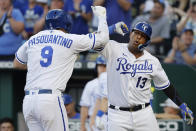 Kansas City Royals' Vinnie Pasquantino (9) celebrates with Salvador Perez (13) after hitting a two-run home run during the first inning of the team's baseball game against the Seattle Mariners in Kansas City, Mo., Saturday, Sept. 24, 2022. (AP Photo/Colin E. Braley)