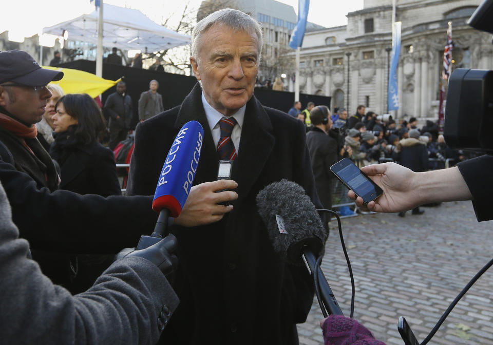 FILE - In this file photo dated Thursday, Nov. 29, 2012, Max Mosley, ex-Formula One boss speaks to the media outside the Queen Elizabeth II Conference Center in London, where Lord Justice Brian Leveson released his report into the culture and practices of the British press and his recommendations for future regulation to prevent phone hacking, data theft, bribery and other abuses. Former Formula One boss and privacy campaigner Max Mosley has died on Sunday May 23, aged 81, it is announced Monday May 24, 2021.(AP Photo/Kirsty Wigglesworth, FILE)