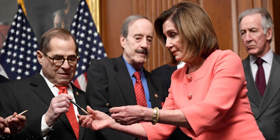 House Speaker Nancy Pelosi of Calif., second from right, gives pens to, from left, House Judiciary Committee Chairman Rep. Jerrold Nadler, D-N.Y., House Foreign Affairs Committee Chairman Rep. Eliot Engel, D-N.Y., and House Ways and Means Committee Chairman Rep. Richard Neal, D-Mass., after she signed the resolution to transmit the two articles of impeachment against President Donald Trump to the Senate for trial on Capitol Hill in Washington, Wednesday, Jan. 15, 2020. The two articles of impeachment against Trump are for abuse of power and obstruction of Congress. (AP Photo/Susan Walsh)