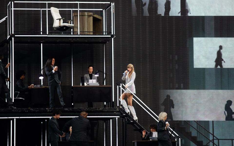 Taylor Swift climbs steps during "The Man" at Acrisure Stadium.