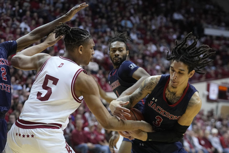 Jackson State forward Trace Young (3) takes the ball from Indiana forward Malik Reneau (5) during the second half of an NCAA college basketball game, Friday, Nov. 25, 2022, in Bloomington, Ind. (AP Photo/Darron Cummings)