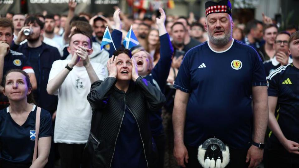Scotland fans look concerned 