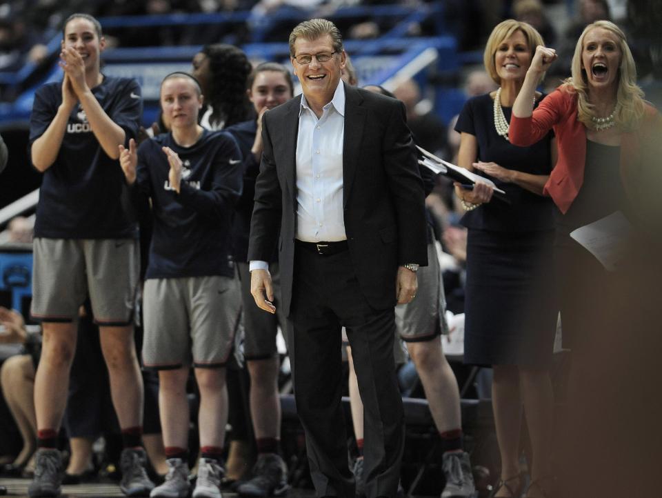 Connecticut head coach Geno Auriemma, center, and his team reacts in the first half of an NCAA college basketball game against South Florida, Tuesday, Jan. 10, 2017, in Hartford, Conn. (AP Photo/Jessica Hill)