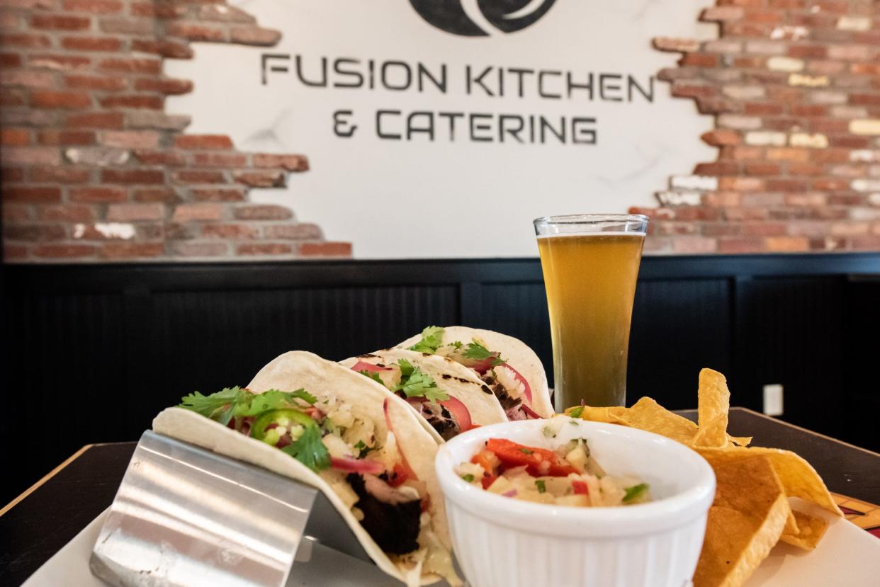 Crooked Eye Brewery is setting up a permanent second location in Chalfont inside Fusion Kitchen. Pictured here is a pint of White Tail Ale paired with achiote flank steak tacos topped with a citrus ginger slaw, pineapple salsa and pickled onions.