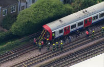 <p>In this aerial image made from video, emergency workers help people to disembark a train near the Parsons Green Underground Station after an explosion in London Friday, Sept. 15, 2017. (Photo: Pool via AP) </p>