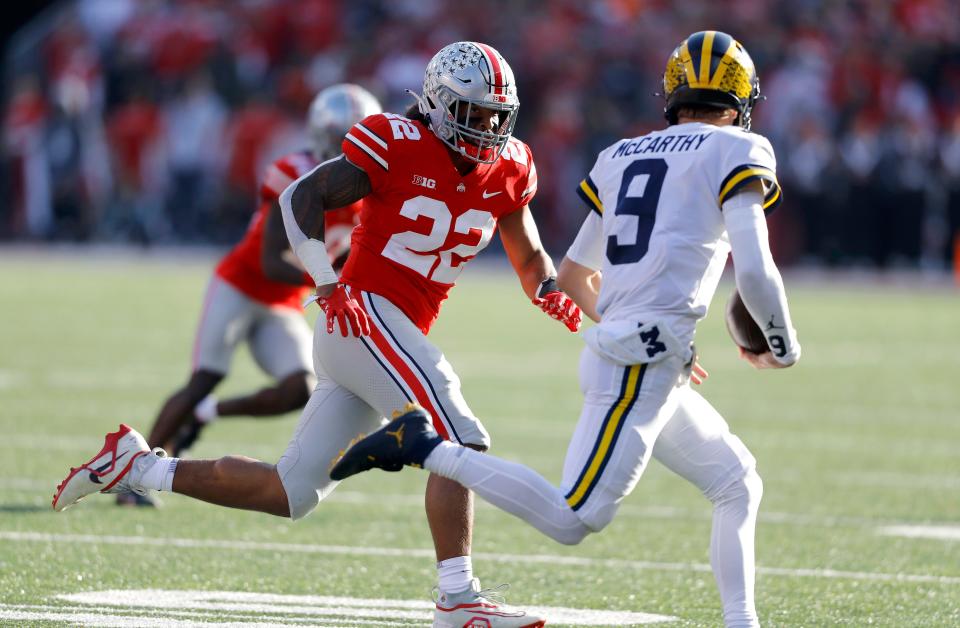 Ohio State Buckeyes linebacker Steele Chambers (22) pursues Michigan quarterback J.J. McCarthy during the second half at Ohio Stadium.