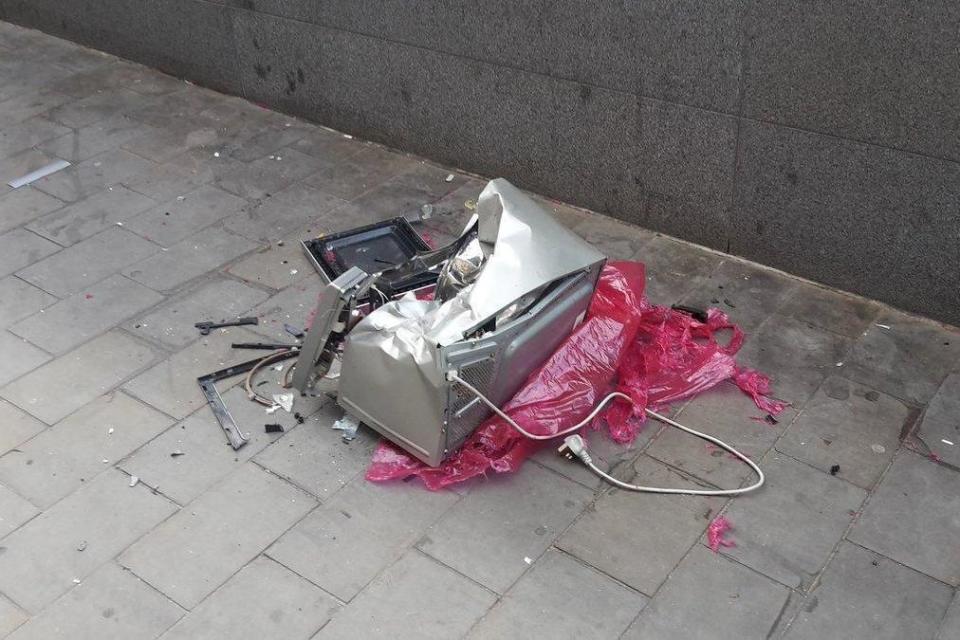 Lockdown: The microwave was seen smashed to pieces in the street (Twitter/Pete M)