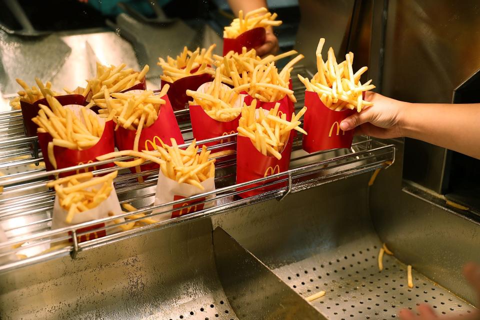 MIAMI, FL - APRIL 25: McDonald's crew member Samantha Medina prepares fries as McDonald's restaurant stock hits record high on April 25, 2017 in Miami, Florida. The company continues to exceed expectations and attributes this to menu changes and other new initiatives it has launched. (Photo by Joe Raedle/Getty Images)