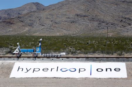 FILE PHOTO: A sled recovery vehicle moves a test sled back to the starting position following a propulsion open-air test at Hyperloop One in North Las Vegas, Nevada, U.S. on May 11, 2016. REUTERS/Steve Marcus/File Photo