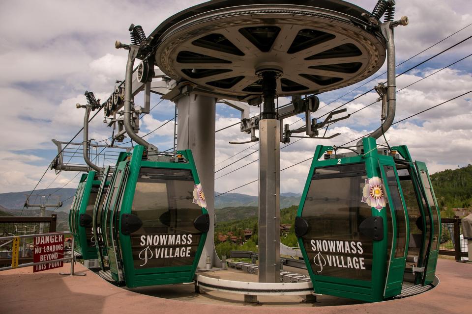 A ski gondola sits idle for the summer in Snowmass, Colorado