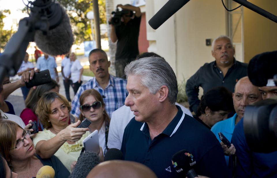 FILE - In this Feb. 24, 2019 file photo, Cuba's President Miguel Diaz-Canel talks to the press after voting in a referendum to approve or reject the new constitution in Havana, Cuba. Only 78 percent of registered voters said “yes” to the new constitution in a Feb. 24 referendum, a massive approval rate in any other country but relatively low for Cuba, where voters usually approve government proposals by margins well over 90 percent. (AP Photo/Ramon Espinosa, File)