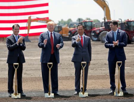 REFILE - ADDING INFORMATION President Donald Trump, along with Terry Gou, founder and chairman of Foxconn, Wisconsin Governor Scott Walker, and Speaker of the House Paul Ryan participate in the Foxconn Technology Group groundbreaking ceremony for its LCD manufacturing campus, in Mount Pleasant, Wisconsin, U.S., June 28, 2018. REUTERS/Darren Hauck