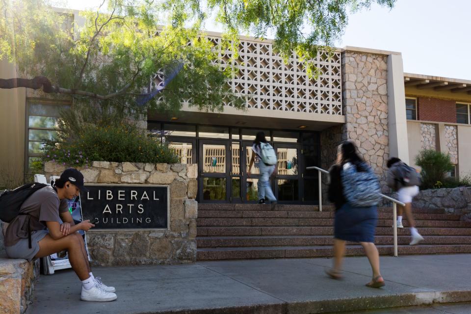 Students walk past the current Liberal Arts Building as UTEP breaks ground on Texas Western Hall on Thursday, Oct. 19, 2023. The new $100m learning complex will replace the old Liberal Arts building.
